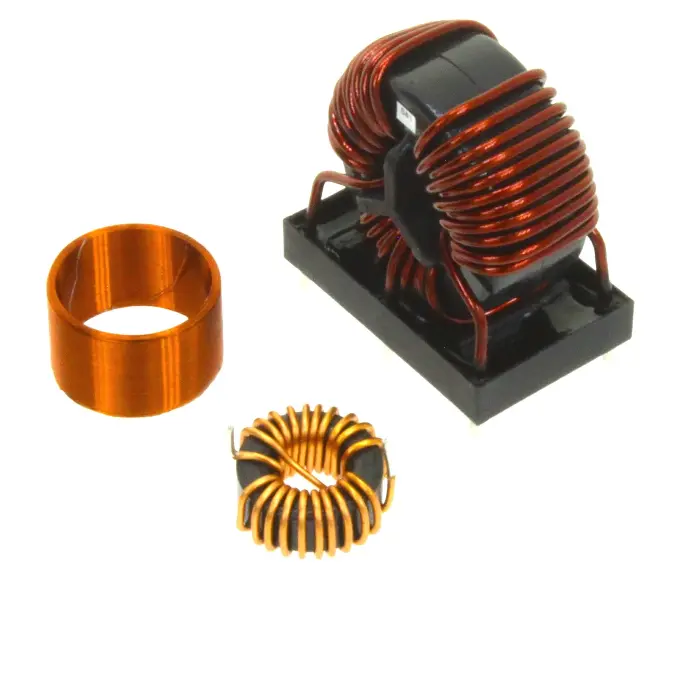 Three electrical inductors: one air coil with copper wire, one inductor on a black base, and one toroidal, arranged side by side.