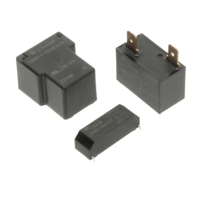 Three relays, positioned next to each other, one black with big connectors, one long and small with smaller leads, one differently shaped.