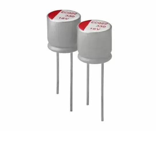 Two similar capacitors, typical pcb through hole capacitors, shape of a cylinder with 2 connection points at the bottom and red marking on top.